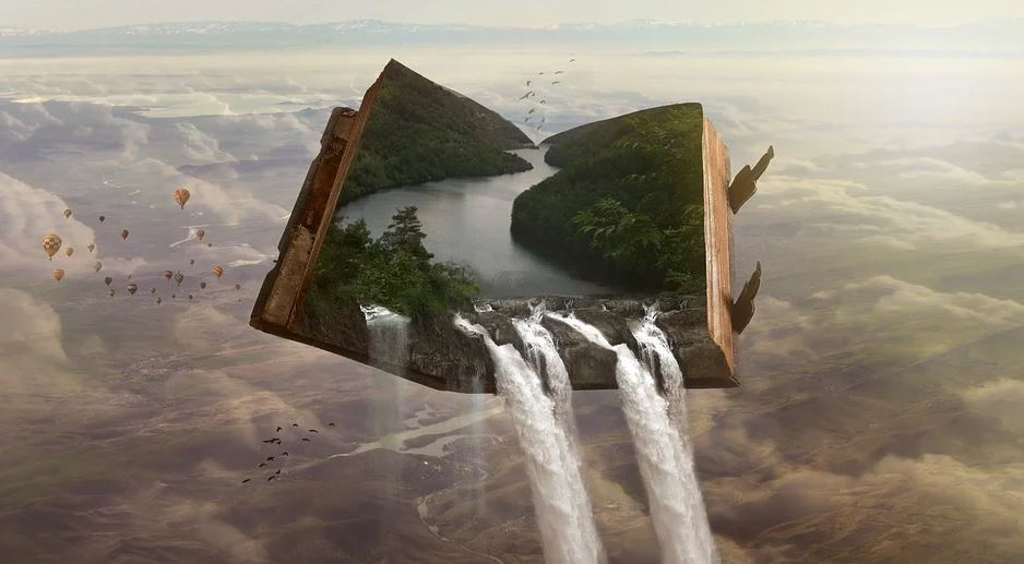 Libro abierto, globos y cascada de agua. 