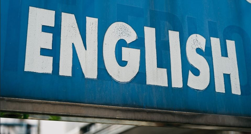 Cartel coa palabra english.