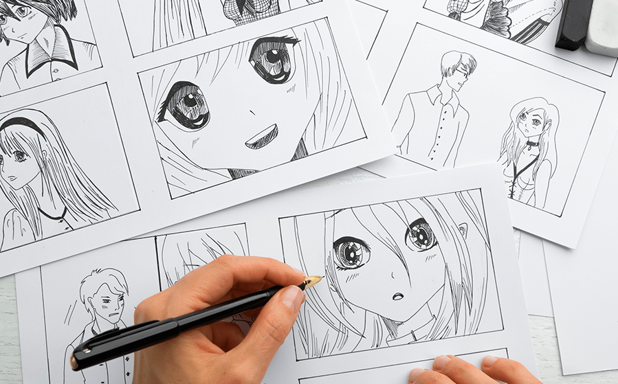 Fotografía de una mano con lápiz dibujando un manga